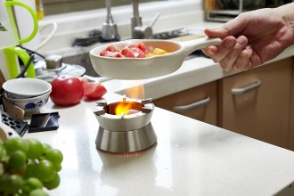 Ember Stove - Compact stainless steel stove.