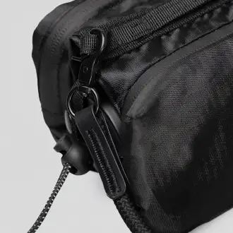  Chili Cross Over Bag - A pouch for carrying essential items, made from RPET material.