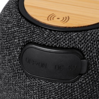 Bandini - Round bluetooth speaker with wireless charger (15W), made of bamboo and RPET polyester.