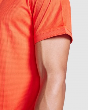 TORMO - Short sleeve technical polo shirt with snap buttons. Recycled polyester, 125 gsm.